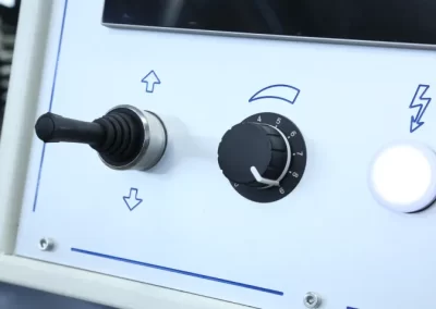 Joystick for manual displacement of the grinding slide, with potentiometer for displacement speed adjustment